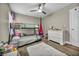 bedroom features a bunk bed, ceiling fan, and cozy decor, perfect for a shared space at 617 Apricot Rose Pl, Las Vegas, NV 89138