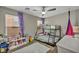 bedroom features a bunk bed, ceiling fan, and cozy decor, perfect for a shared space at 617 Apricot Rose Pl, Las Vegas, NV 89138