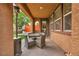 Cozy covered patio with outdoor dining set, perfect for entertaining or relaxing outdoors at 617 Apricot Rose Pl, Las Vegas, NV 89138
