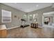 Open entry room with tile floors, neutral wall paint, and a small workout area at 617 Apricot Rose Pl, Las Vegas, NV 89138