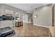 Bright exercise room features neutral walls, recessed lighting, and tile floors with a treadmill at 617 Apricot Rose Pl, Las Vegas, NV 89138