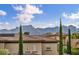 Beautiful home exterior with well-maintained landscaping and mountain views in a desirable neighborhood at 617 Apricot Rose Pl, Las Vegas, NV 89138