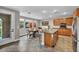 Inviting eat-in kitchen features a granite island, stainless steel appliances, and dining area at 617 Apricot Rose Pl, Las Vegas, NV 89138