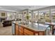 Bright kitchen with granite countertops, stainless steel appliances and an island with bar seating at 617 Apricot Rose Pl, Las Vegas, NV 89138