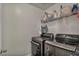 A practical laundry area with modern stainless-steel appliances and plenty of storage space at 617 Apricot Rose Pl, Las Vegas, NV 89138