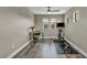 Bright open loft featuring hard surface floors, an office setup and work out equipment at 617 Apricot Rose Pl, Las Vegas, NV 89138
