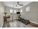 This open loft area features a ceiling fan, office, tv and workout equipment at 617 Apricot Rose Pl, Las Vegas, NV 89138