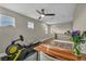 Spacious loft with hard surface floors, a ceiling fan, an office and exercise equipment at 617 Apricot Rose Pl, Las Vegas, NV 89138