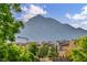 Charming neighborhood street with well-kept homes, lush trees, and a mountain backdrop at 617 Apricot Rose Pl, Las Vegas, NV 89138