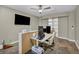 Office with built-in desk, multiple monitors, and a rolling office chair, well-lit by ceiling lights at 617 Apricot Rose Pl, Las Vegas, NV 89138