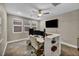 Office featuring a built-in desk, multiple monitors, modern chair, and ample natural light at 617 Apricot Rose Pl, Las Vegas, NV 89138
