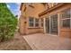 Paver patio of this two-story home with a sliding glass door for outdoor living at 617 Apricot Rose Pl, Las Vegas, NV 89138
