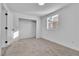 Bright, carpeted bedroom with a closet and natural light, featuring fresh paint and a neutral color scheme at 617 Stanford St, Las Vegas, NV 89107