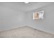 Well-lit bedroom with window and neutral carpet at 617 Stanford St, Las Vegas, NV 89107