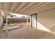 Covered patio with brick flooring and access door to backyard at 617 Stanford St, Las Vegas, NV 89107