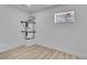 Bright utility room with modern flooring, new water heater, and window, perfect for laundry and storage at 617 Stanford St, Las Vegas, NV 89107
