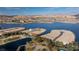 Stunning aerial view of the waterfront properties and golf course at 69 Bellissima Lago Ct, Henderson, NV 89011