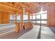 Bright living room features wood framing, large windows, and lake views at 69 Bellissima Lago Ct, Henderson, NV 89011
