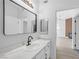 Bright bathroom featuring a sleek vanity with a modern faucet and stylish mirror at 700 Carnegie St # 3913, Henderson, NV 89052