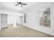 Bedroom features neutral carpet, a ceiling fan, and arched windows for ample natural light at 700 Carnegie St # 3913, Henderson, NV 89052