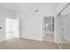 Bright bedroom with carpeted floors and an attached bathroom at 700 Carnegie St # 3913, Henderson, NV 89052