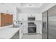 Contemporary kitchen featuring stainless steel appliances, white cabinetry, and quartz countertops at 700 Carnegie St # 3913, Henderson, NV 89052