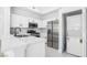 Bright kitchen features white cabinets, stainless appliances, and a stylish countertop bar at 700 Carnegie St # 3913, Henderson, NV 89052