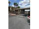 A gated entrance to the community with lush landscaping at 7131 S Durango Dr # 104, Las Vegas, NV 89113