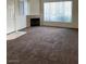 Bright living room with large windows and a fireplace at 7131 S Durango Dr # 104, Las Vegas, NV 89113