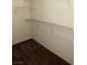A walk-in closet, equipped with metal shelving for organizing clothes and accessories at 7131 S Durango Dr # 104, Las Vegas, NV 89113