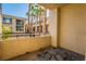 Comfortable balcony space overlooking the neighborhood and mature palm trees at 7189 S Durango Dr # 203, Las Vegas, NV 89113