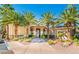 Attractive building entrance, with palm trees and well maintained landscaping at 7189 S Durango Dr # 203, Las Vegas, NV 89113