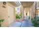 Inviting entrance leading to unit 203 with well maintained landscaping at 7189 S Durango Dr # 203, Las Vegas, NV 89113