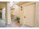 Condominium front door with neutral paint, well maintained landscaping at 7189 S Durango Dr # 203, Las Vegas, NV 89113