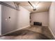 Spacious garage with concrete floors, overhead lighting, and ample room for storage at 7189 S Durango Dr # 203, Las Vegas, NV 89113