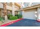 Attached garage with landscaped curb appeal at 7189 S Durango Dr # 203, Las Vegas, NV 89113