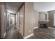 Inviting living room with wood-look floors and a cozy fireplace adding warmth and character at 7189 S Durango Dr # 203, Las Vegas, NV 89113