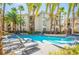 Inviting pool area featuring resort style pool and palm trees at 7189 S Durango Dr # 203, Las Vegas, NV 89113