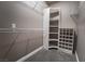 Spacious walk-in closet with custom shelving units and wire racks for ample storage at 7189 S Durango Dr # 203, Las Vegas, NV 89113