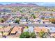 Aerial view of the neighborhood with mountain backdrop and visible community amenities at 729 Scottsdale St, Henderson, NV 89002