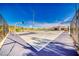 Outdoor basketball court with hoops and mountain views in the background at 729 Scottsdale St, Henderson, NV 89002