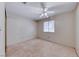 Bright bedroom with neutral carpet, ceiling fan, a window and a closet at 729 Scottsdale St, Henderson, NV 89002
