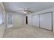 Bedroom featuring a ceiling fan, carpet, window and an attached bathroom with a stand up shower at 729 Scottsdale St, Henderson, NV 89002