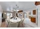 Open dining area features a modern chandelier, adjacent to the kitchen and living spaces at 729 Scottsdale St, Henderson, NV 89002