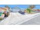 Long driveway leading to a two-car garage with ample parking space at 729 Scottsdale St, Henderson, NV 89002