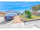 Charming front yard with a well-maintained lawn, mature tree, and fenced yard at 729 Scottsdale St, Henderson, NV 89002