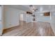 Large living area with wood floors leading to the kitchen and sunroom at 729 Scottsdale St, Henderson, NV 89002