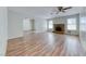 Open-concept living room with hardwood floors, fireplace and bright windows at 729 Scottsdale St, Henderson, NV 89002
