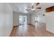 Bright living room with wood floors and ceiling fan, adjacent to sunroom at 729 Scottsdale St, Henderson, NV 89002
