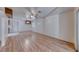 Spacious living area with wood floors connecting to kitchen and exterior door at 729 Scottsdale St, Henderson, NV 89002